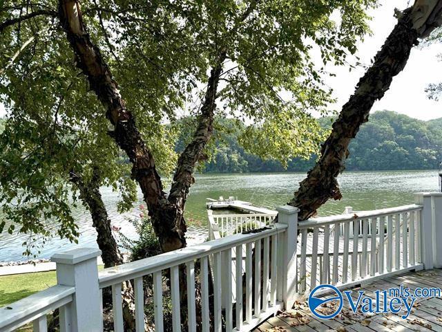 wooden terrace with a water view