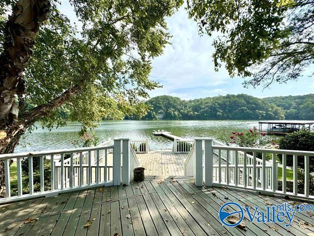 wooden deck featuring a water view