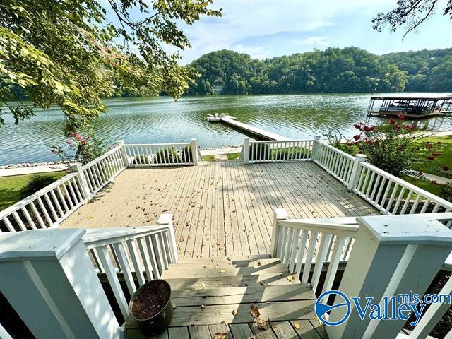 wooden deck featuring a water view