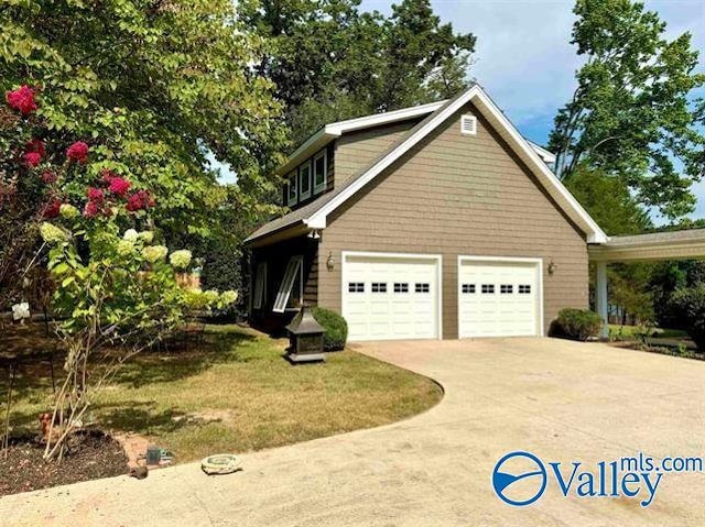 view of home's exterior with a garage, a lawn, and concrete driveway