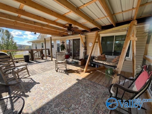 view of patio / terrace with ceiling fan and a deck