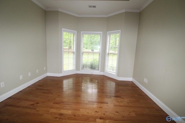 730 John Cabaniss Rd, Langston, AL 35755 - empty room featuring wood finished floors, ornamental molding, and baseboards