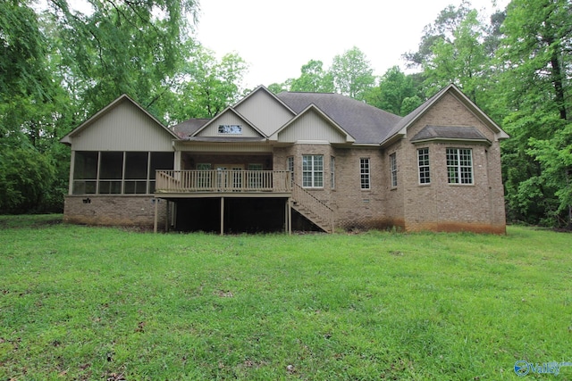 730 John Cabaniss Rd, Langston, AL 35755 - back of property featuring a deck, a yard, stairway, brick siding, and a sunroom