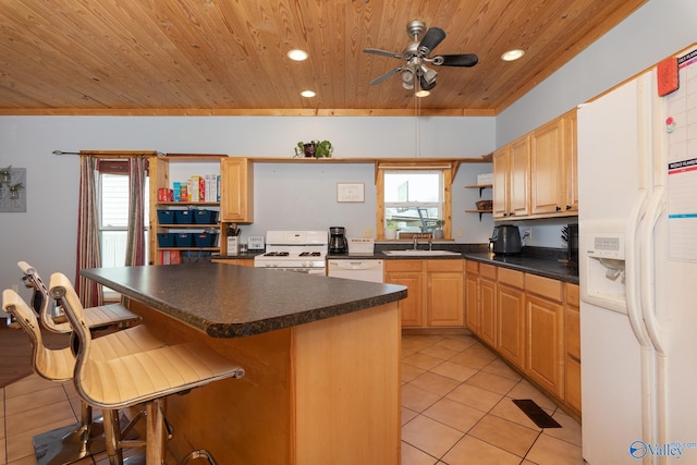 kitchen featuring ceiling fan, wooden ceiling, light brown cabinets, white appliances, and light tile patterned floors