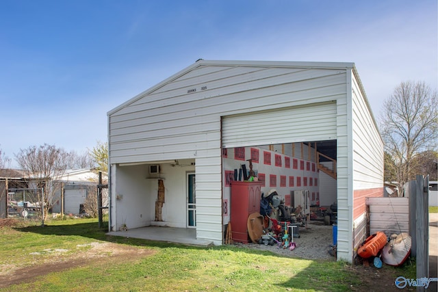 view of outbuilding with a lawn