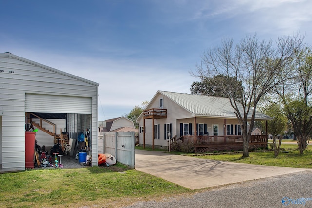 exterior space with an outdoor structure and a front lawn