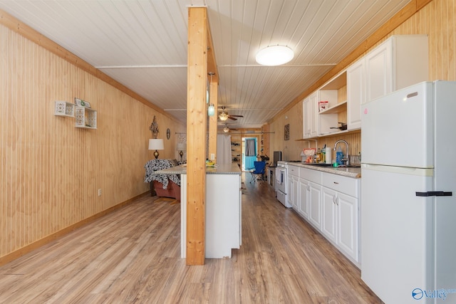 kitchen featuring white cabinetry, white refrigerator, sink, light hardwood / wood-style flooring, and wood ceiling