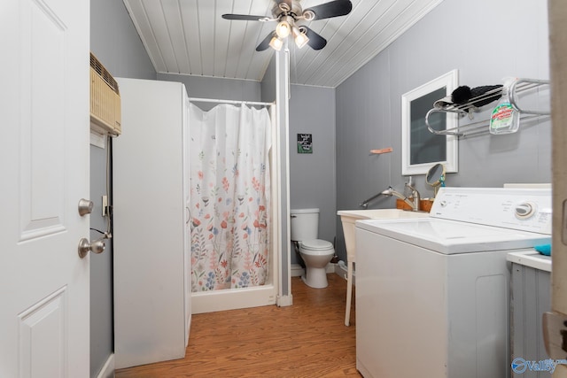 laundry area featuring ornamental molding, washer / clothes dryer, ceiling fan, and light wood-type flooring