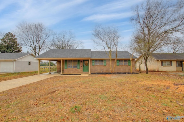 single story home featuring a front lawn and a carport