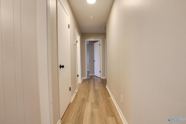 hall with light hardwood / wood-style floors