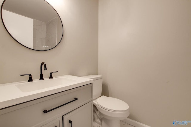 bathroom with toilet and vanity