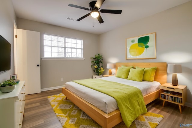 bedroom featuring ceiling fan and hardwood / wood-style floors