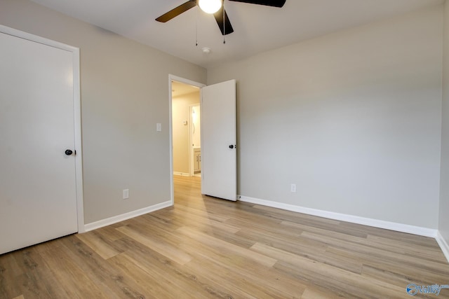 unfurnished bedroom featuring ceiling fan and light hardwood / wood-style flooring