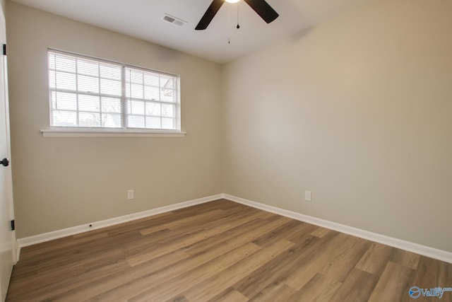 empty room featuring ceiling fan and hardwood / wood-style floors