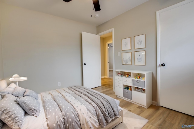 bedroom featuring ceiling fan and light hardwood / wood-style flooring