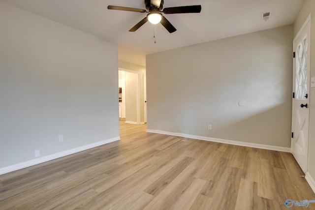 unfurnished room featuring ceiling fan and light hardwood / wood-style flooring