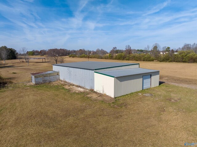 view of outdoor structure featuring a rural view