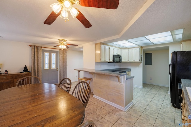 dining room featuring light tile patterned flooring and ceiling fan