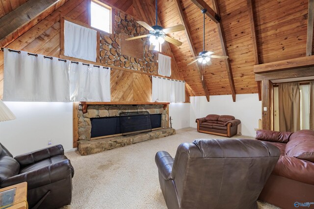 carpeted living room with a stone fireplace, wooden ceiling, and high vaulted ceiling