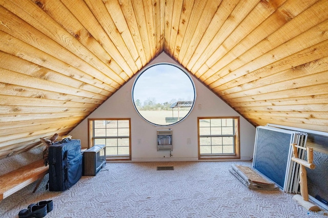 additional living space featuring wooden ceiling, a healthy amount of sunlight, light colored carpet, and vaulted ceiling