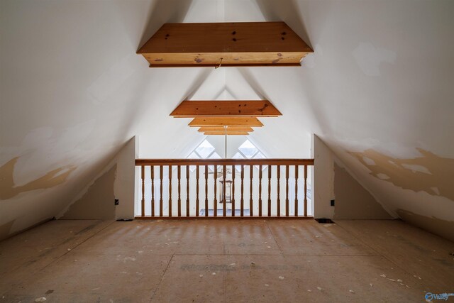 additional living space featuring vaulted ceiling