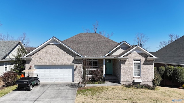 view of front of house featuring brick siding, concrete driveway, roof with shingles, a front yard, and an attached garage