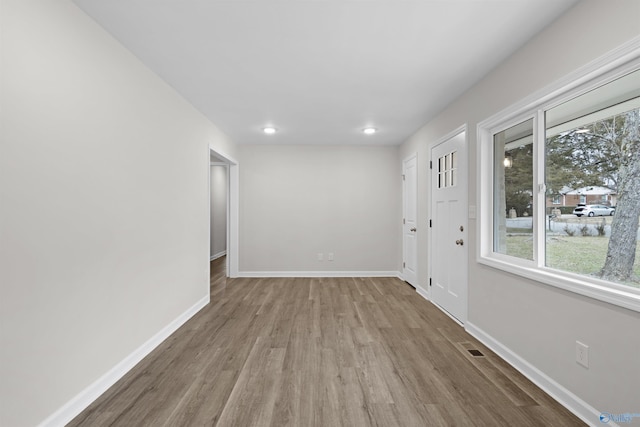 unfurnished room with light hardwood / wood-style floors