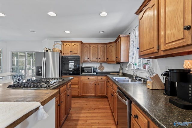 kitchen featuring a sink, brown cabinets, and appliances with stainless steel finishes