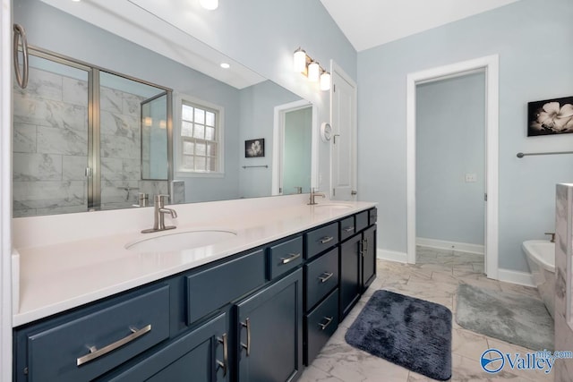 bathroom with marble finish floor, double vanity, and a sink