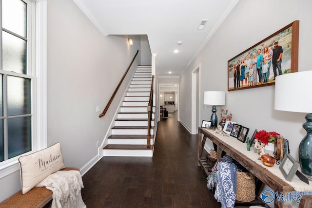 entryway with baseboards, stairs, ornamental molding, and dark wood finished floors