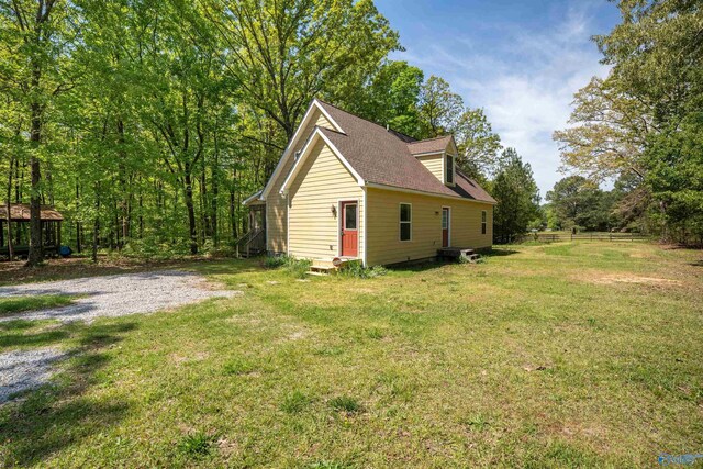 970 County Road 454, Centre, AL 35960 - view of side of property featuring a yard, a shingled roof, and fence