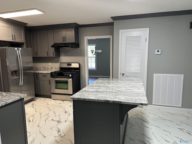 kitchen with marble finish floor, visible vents, stainless steel appliances, and under cabinet range hood