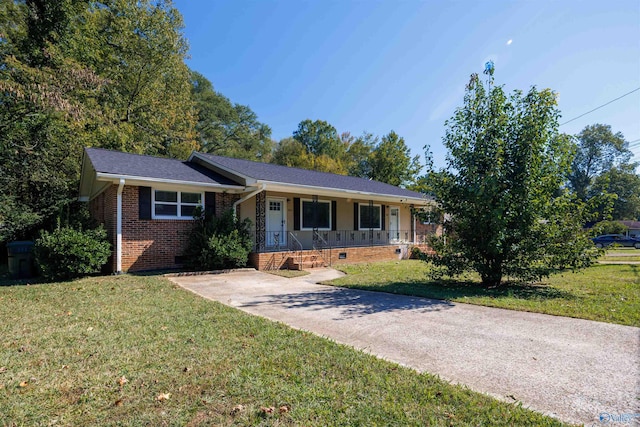 single story home with a front yard and covered porch