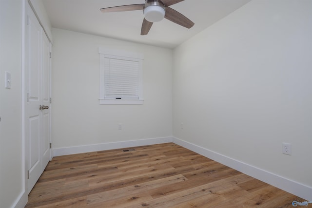 spare room featuring hardwood / wood-style flooring and ceiling fan