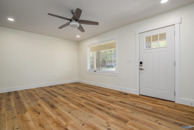 entrance foyer with light hardwood / wood-style floors, a healthy amount of sunlight, and ceiling fan