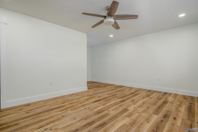 unfurnished room featuring ceiling fan and light hardwood / wood-style flooring