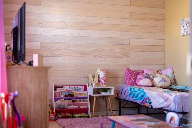 bedroom with wooden walls