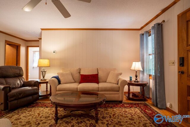 93 County Road 600, Mentone, AL 35984 - living area featuring crown molding, a ceiling fan, and wood finished floors