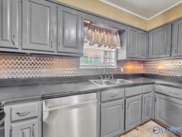 201 10th Ave NW, Decatur, AL 35601 - kitchen with stainless steel dishwasher, gray cabinets, a sink, dark countertops, and ornamental molding