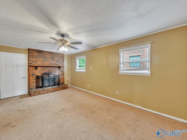 201 10th Ave NW, Decatur, AL 35601 - unfurnished living room with ceiling fan, carpet flooring, baseboards, a textured ceiling, and crown molding