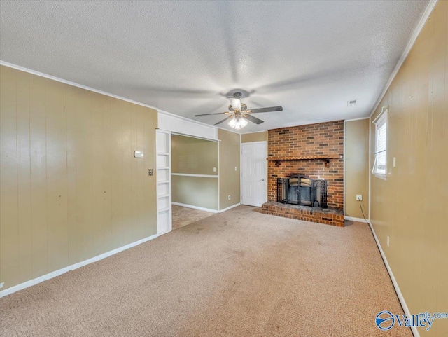 201 10th Ave NW, Decatur, AL 35601 - unfurnished living room with ceiling fan, a textured ceiling, carpet, crown molding, and baseboards