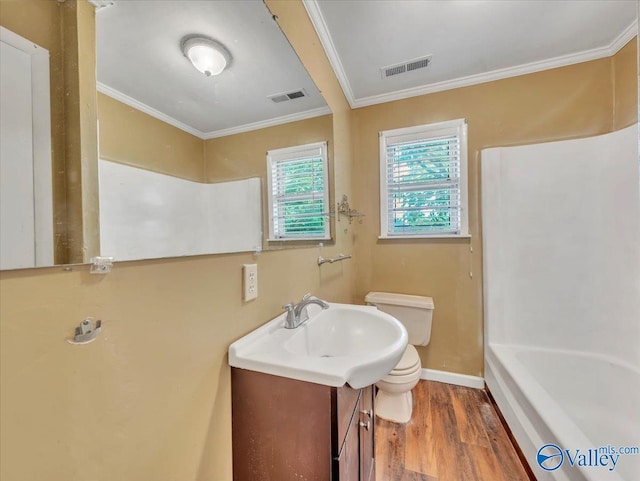 201 10th Ave NW, Decatur, AL 35601 - bathroom with toilet, crown molding, vanity, wood finished floors, and baseboards