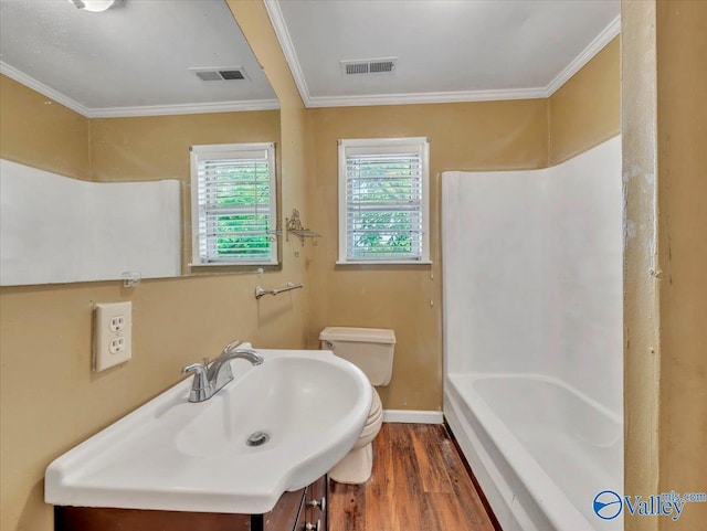 201 10th Ave NW, Decatur, AL 35601 - bathroom featuring toilet, wood finished floors, ornamental molding, vanity, and baseboards