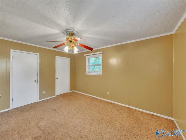 201 10th Ave NW, Decatur, AL 35601 - unfurnished bedroom with carpet floors, a textured ceiling, crown molding, a ceiling fan, and baseboards
