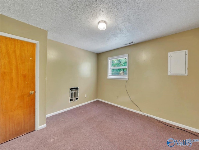 201 10th Ave NW, Decatur, AL 35601 - carpeted empty room with baseboards, a textured ceiling, heating unit, and electric panel