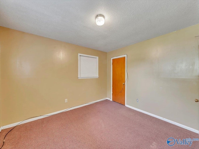 201 10th Ave NW, Decatur, AL 35601 - empty room featuring carpet flooring, baseboards, and a textured ceiling
