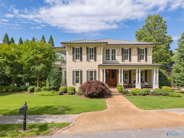 19 Ledges Main SE, Huntsville, AL 35802 - view of front of home featuring a porch, a standing seam roof, a front yard, and metal roof