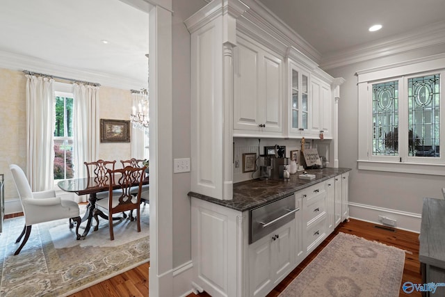19 Ledges Main SE, Huntsville, AL 35802 - bar with a chandelier, a warming drawer, baseboards, dark wood-type flooring, and crown molding