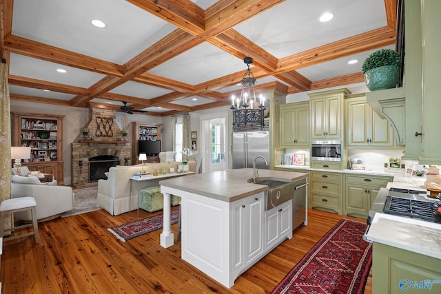 19 Ledges Main SE, Huntsville, AL 35802 - kitchen with appliances with stainless steel finishes, a sink, green cabinetry, coffered ceiling, and light countertops