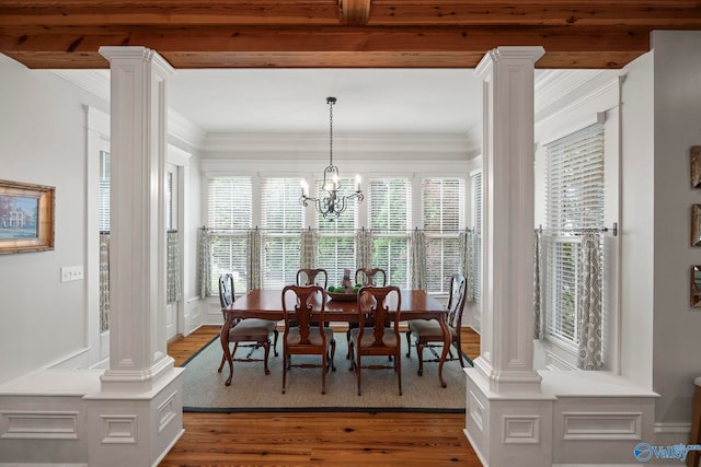 19 Ledges Main SE, Huntsville, AL 35802 - dining area featuring decorative columns, wood finished floors, crown molding, and a chandelier